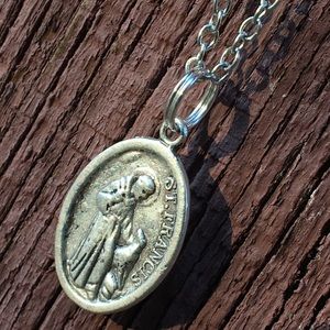 Saint Francis of Assisi with wolf medal on chain
